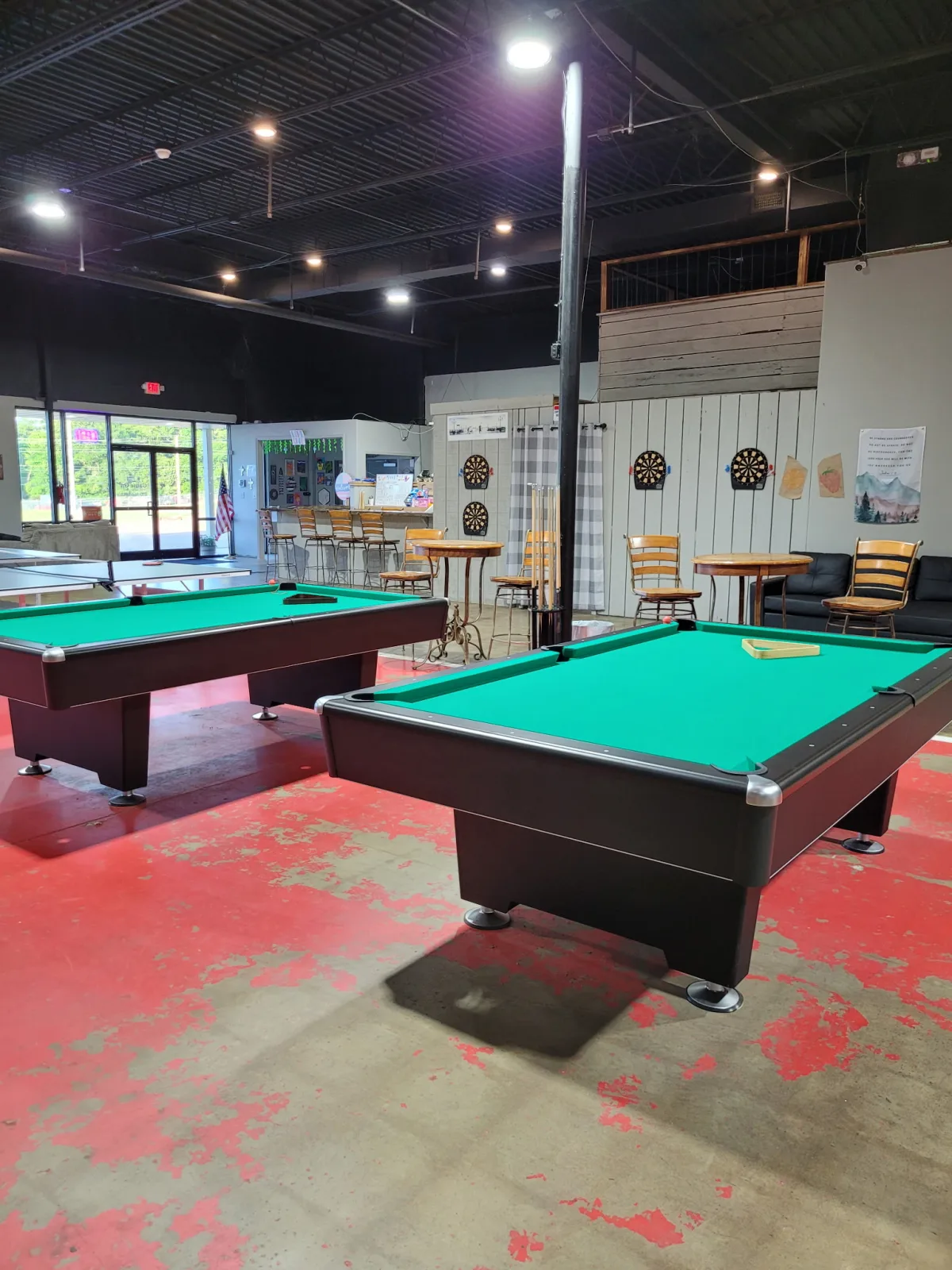 Pool tables and dartboards in the Game On play area